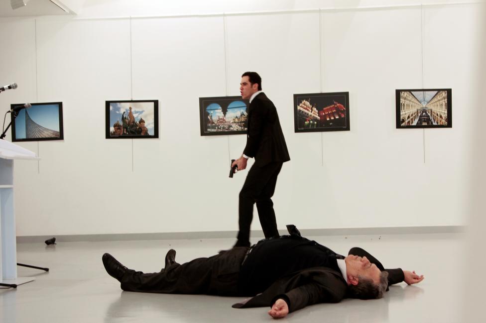Russian Ambassador to Turkey Andrei Karlov lies on the ground after he was shot by Mevlut Mert Altintas at an art gallery in Ankara